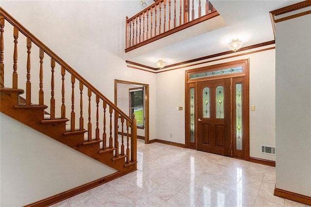 402 Clyde Ct, Mcdonough, GA 30252 - foyer featuring stairway, crown molding, and a towering ceiling