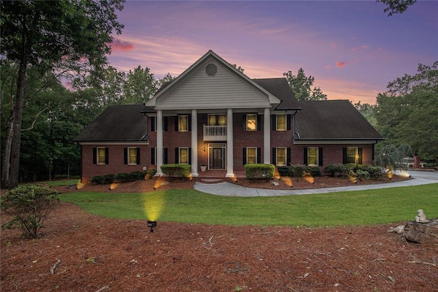 402 Clyde Ct, Mcdonough, GA 30252 - neoclassical home featuring a yard and brick siding