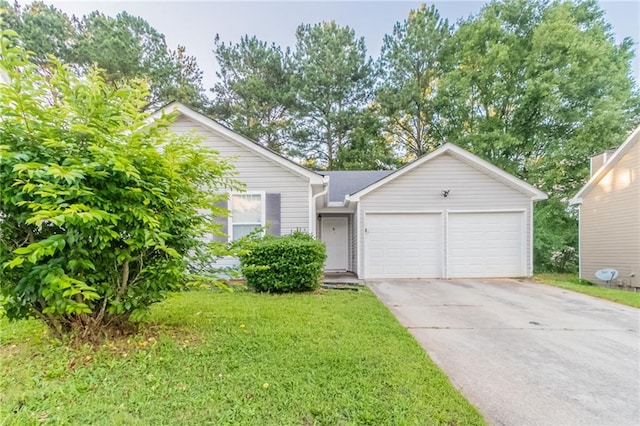 6304 Kendra Ln, Lithonia, GA 30058 - view of front of house with a garage, driveway, and a front yard
