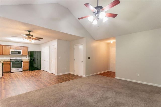 6304 Kendra Ln, Lithonia, GA 30058 - unfurnished living room with a ceiling fan, light carpet, and high vaulted ceiling