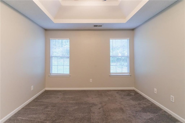 6304 Kendra Ln, Lithonia, GA 30058 - carpeted spare room featuring a raised ceiling and baseboards