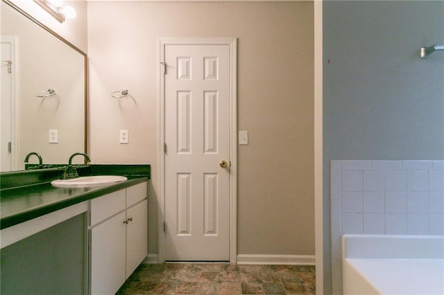 6304 Kendra Ln, Lithonia, GA 30058 - bathroom featuring vanity and a garden tub