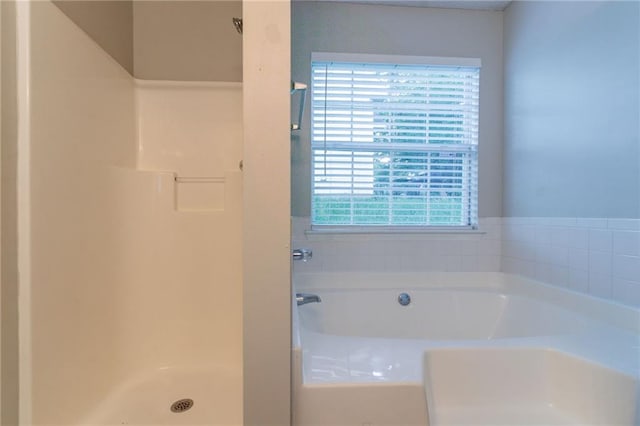 6304 Kendra Ln, Lithonia, GA 30058 - bathroom featuring a bath and a shower