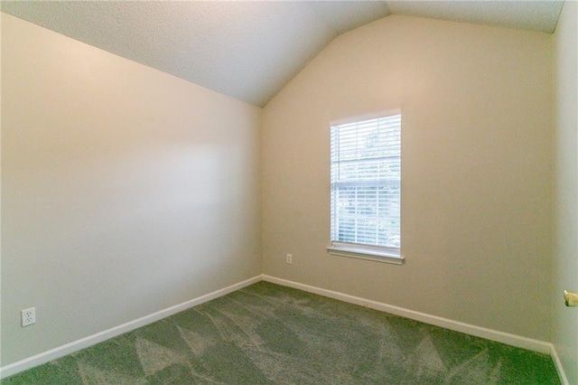 6304 Kendra Ln, Lithonia, GA 30058 - spare room with lofted ceiling and dark colored carpet