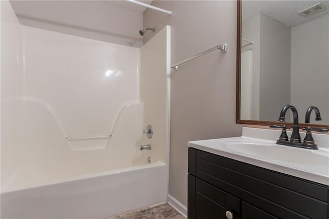 6304 Kendra Ln, Lithonia, GA 30058 - full bath with vanity, washtub / shower combination, and a textured ceiling