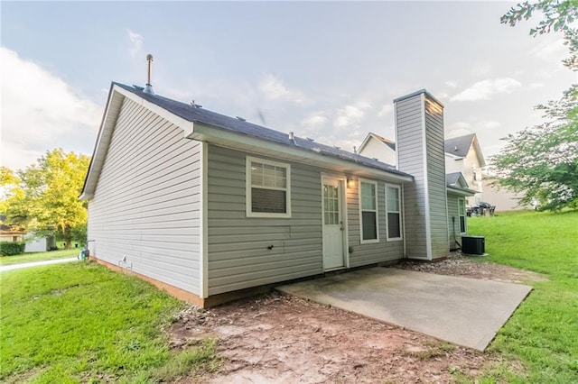 6304 Kendra Ln, Lithonia, GA 30058 - back of property featuring a patio area, a lawn, and a chimney