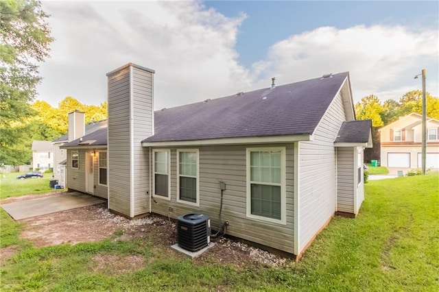 6304 Kendra Ln, Lithonia, GA 30058 - rear view of house featuring a lawn and a chimney