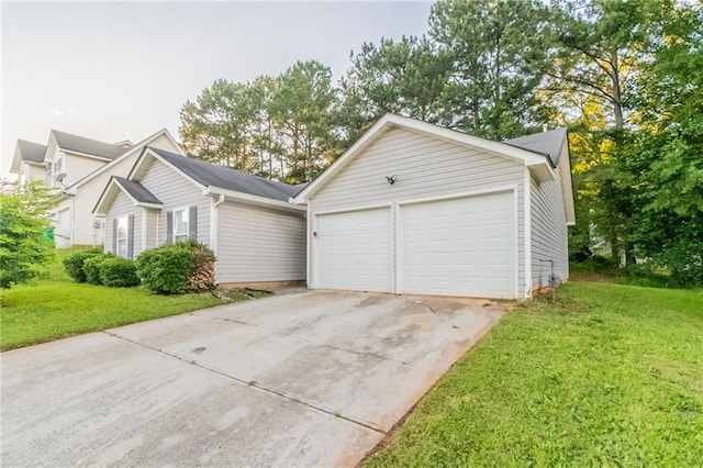 6304 Kendra Ln, Lithonia, GA 30058 - view of front of home with a front lawn, concrete driveway, and a garage
