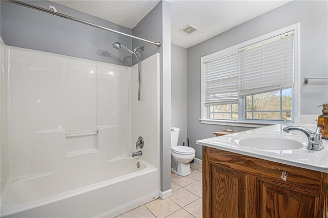 full bath with tile patterned flooring, vanity, toilet, a textured ceiling, and visible vents