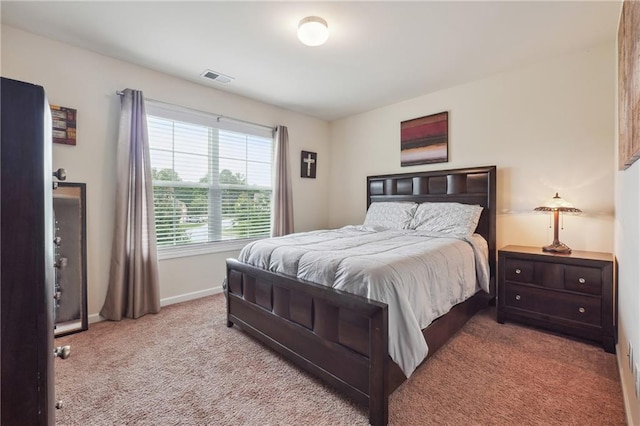 bedroom featuring carpet flooring, visible vents, and baseboards