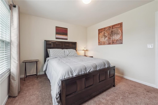 bedroom featuring carpet floors and baseboards