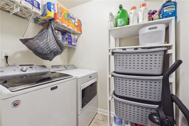 clothes washing area with laundry area and washer and clothes dryer