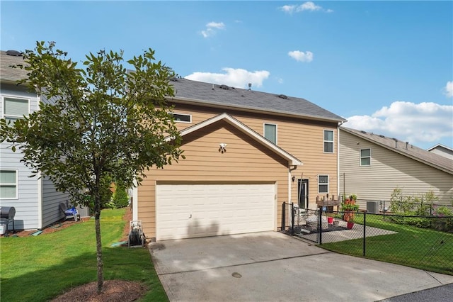 view of front of house with a garage, concrete driveway, fence, cooling unit, and a front yard