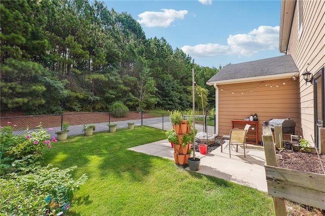 view of yard with a patio area and fence