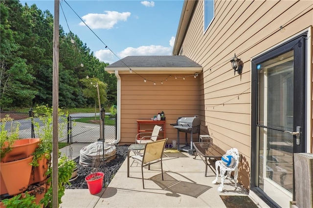 view of patio with fence and grilling area