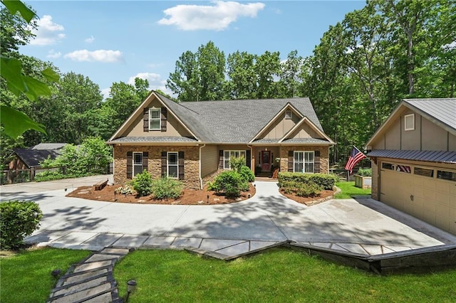 2945 Ashbyrn Ct, Buford, GA 30519 - craftsman-style home with stone siding, driveway, a porch, a garage, and an outdoor structure