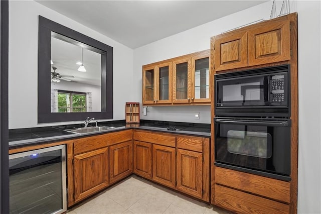 2945 Ashbyrn Ct, Buford, GA 30519 - kitchen with wine cooler, black appliances, brown cabinetry, a sink, and dark countertops
