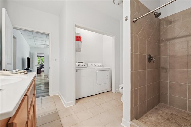 2945 Ashbyrn Ct, Buford, GA 30519 - full bath with washer and clothes dryer, tiled shower, and tile patterned flooring