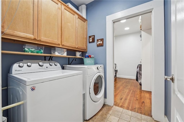 2945 Ashbyrn Ct, Buford, GA 30519 - clothes washing area featuring cabinet space, independent washer and dryer, light tile patterned flooring, and recessed lighting