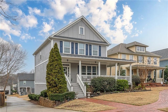 view of front of property featuring covered porch and a front yard