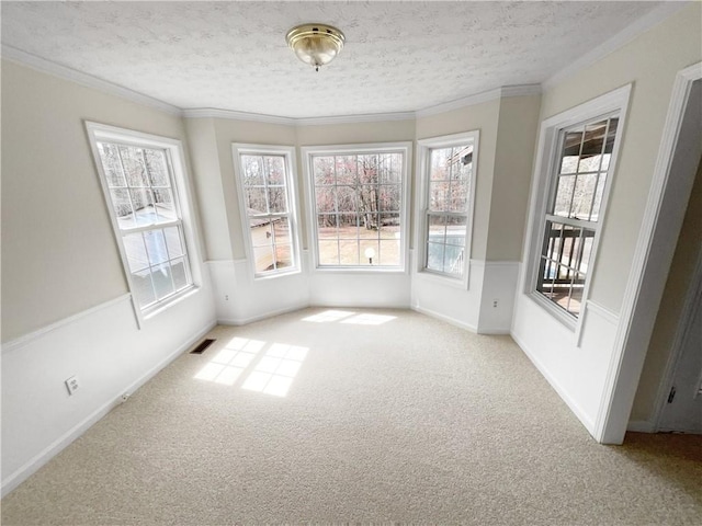 unfurnished sunroom featuring visible vents