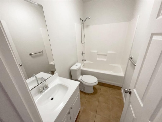 bathroom with tile patterned floors, toilet, vanity, and shower / bathing tub combination