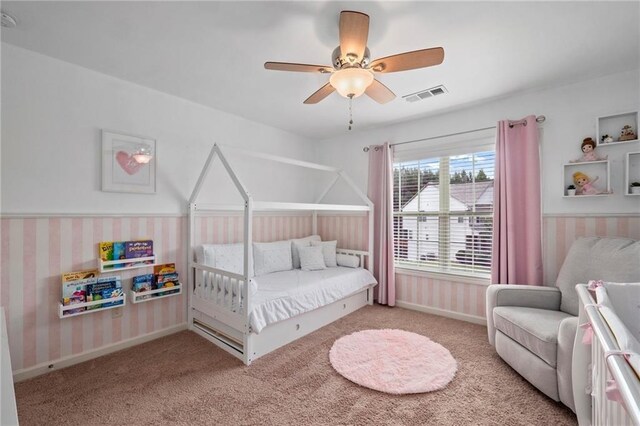 carpeted bedroom with ceiling fan