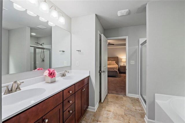 bathroom featuring vanity, tile patterned floors, and shower with separate bathtub