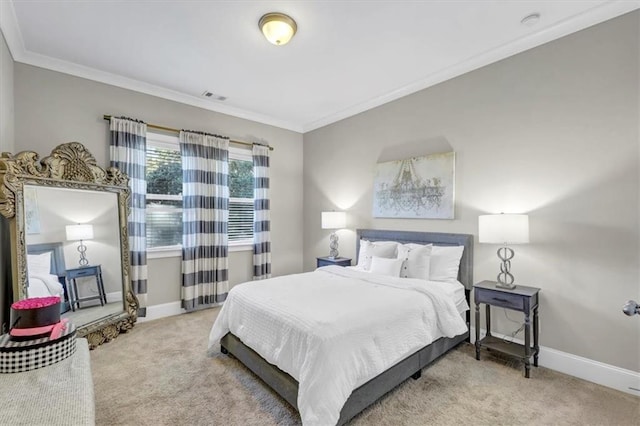 bedroom featuring ornamental molding and carpet flooring