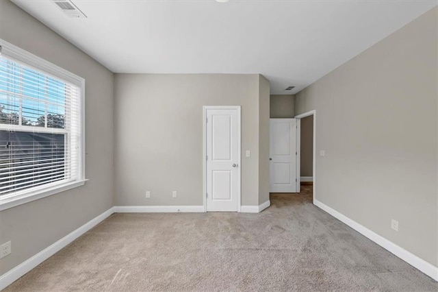 unfurnished bedroom with light carpet