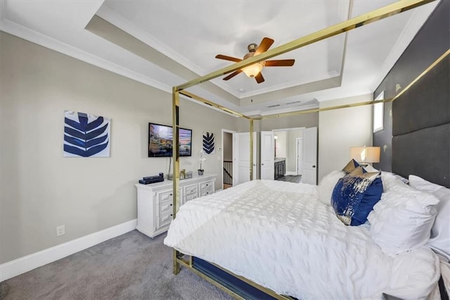 bedroom with a tray ceiling, ornamental molding, and ceiling fan