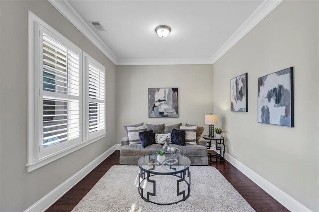 living room with crown molding and dark hardwood / wood-style flooring