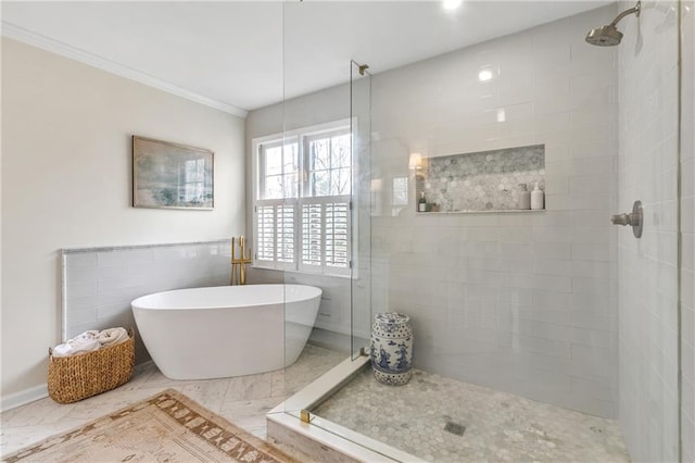 bathroom with shower with separate bathtub, tile walls, and crown molding