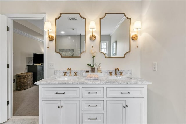 bathroom with vanity and crown molding