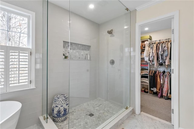 bathroom with separate shower and tub