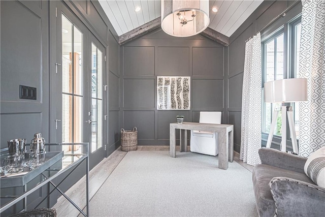 interior space featuring french doors, carpet floors, wood ceiling, and vaulted ceiling