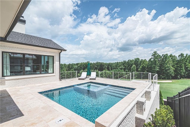 view of pool with an in ground hot tub and a patio