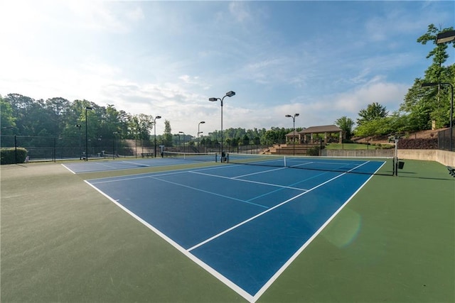 view of tennis court featuring basketball court