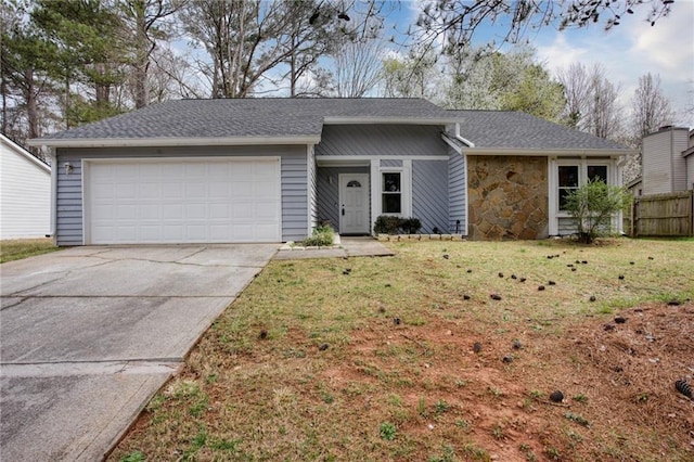 4938 Terrace Green Trce, Stone Mountain, GA 30088 - view of front of house featuring a garage, driveway, stone siding, and a shingled roof