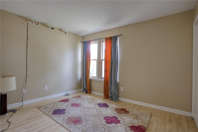 4938 Terrace Green Trce, Stone Mountain, GA 30088 - unfurnished room with wood finished floors and a textured ceiling