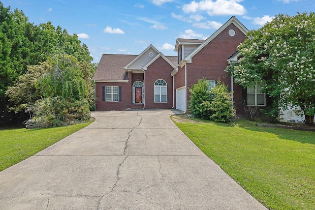 4591 Millstone Walk Dr NE, Buford, GA 30519 - traditional home featuring concrete driveway, a front yard, brick siding, and a garage