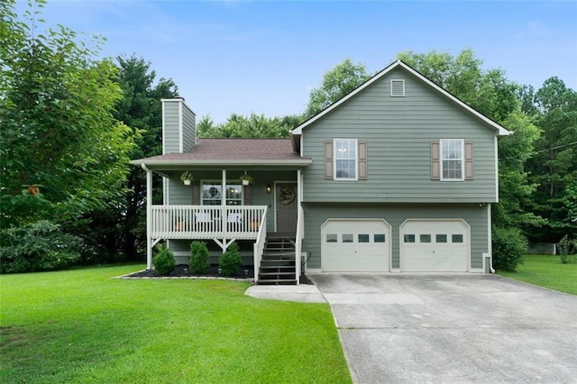 427 Pleasant Way, Temple, GA 30179 - split level home featuring a chimney, covered porch, a front yard, a garage, and driveway