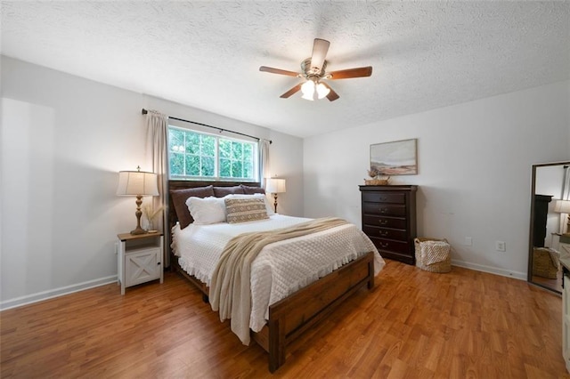 427 Pleasant Way, Temple, GA 30179 - bedroom with wood finished floors, a textured ceiling, and a ceiling fan