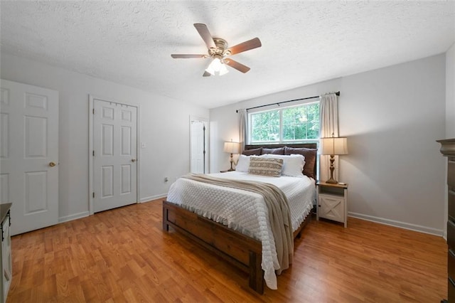 427 Pleasant Way, Temple, GA 30179 - bedroom with wood finished floors, a textured ceiling, and a ceiling fan