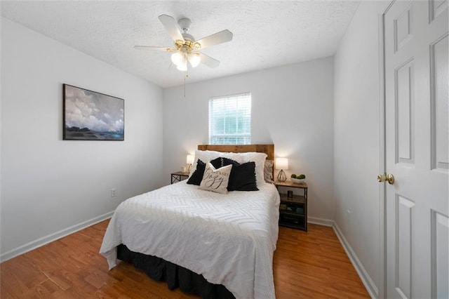 427 Pleasant Way, Temple, GA 30179 - bedroom with wood finished floors, a textured ceiling, and ceiling fan
