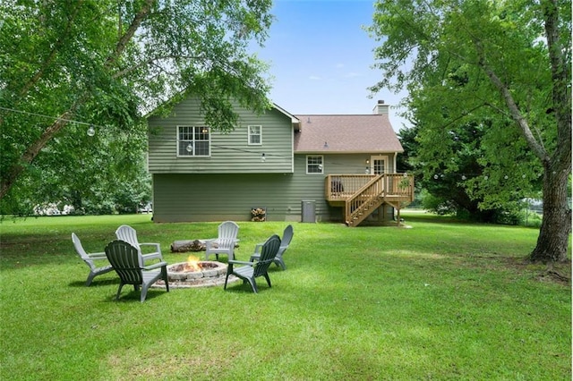 427 Pleasant Way, Temple, GA 30179 - back of property with an outdoor fire pit, a deck, stairway, a chimney, and a lawn