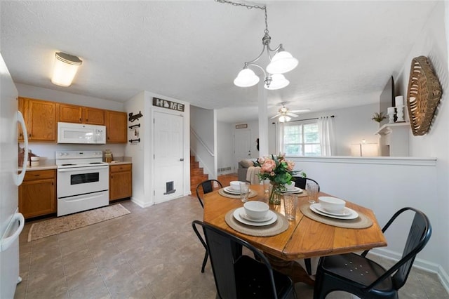 427 Pleasant Way, Temple, GA 30179 - dining room featuring stairway, a chandelier, a ceiling fan, and a textured ceiling