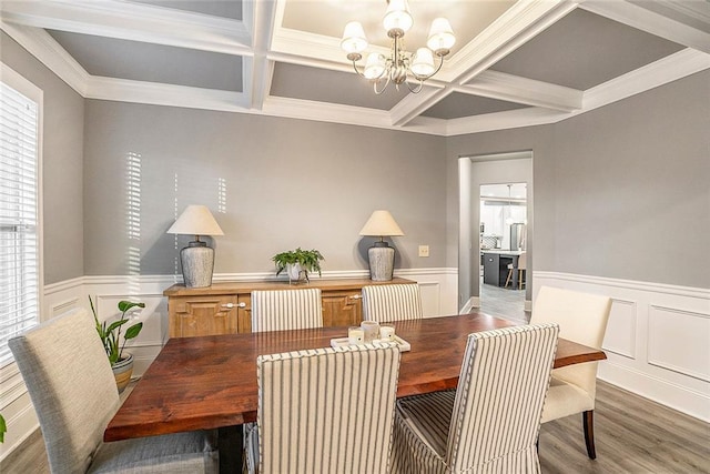 dining room featuring beamed ceiling, a chandelier, and coffered ceiling