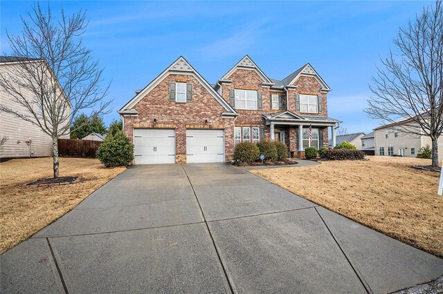 view of front facade featuring a front lawn and a garage