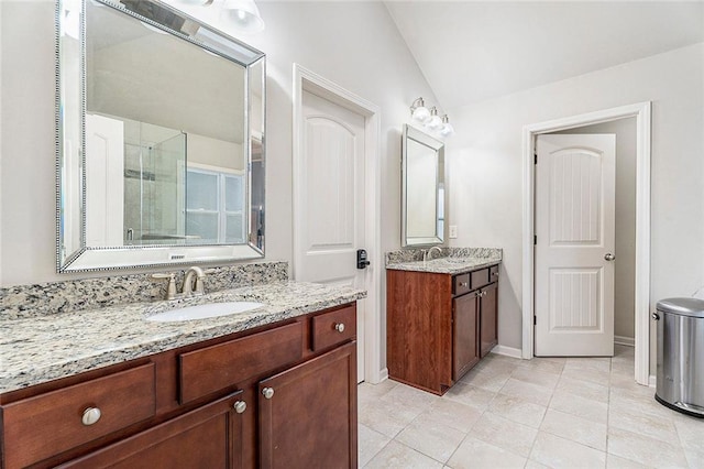 bathroom featuring tile patterned flooring, vanity, an enclosed shower, and lofted ceiling